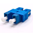 A blue LC/UPC Female to SC/UPC Male Hybrid Duplex Single Mode Fiber Optic Adapter without flange.