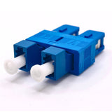 A blue LC/UPC Female to SC/UPC Male Hybrid Duplex Single Mode Fiber Optic Adapter without flange.